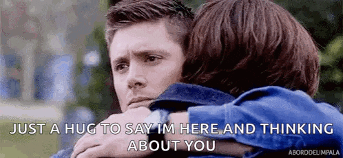 a man and a woman hugging each other with the words `` just a hug to say i 'm here and thinking about you ''