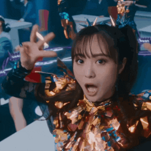 a woman with a surprised look on her face is wearing a colorful outfit