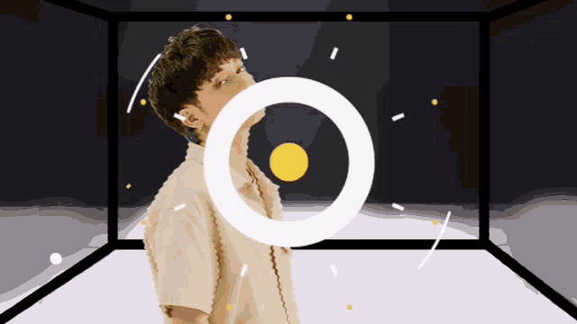 a man is standing in a room with a white circle around his head