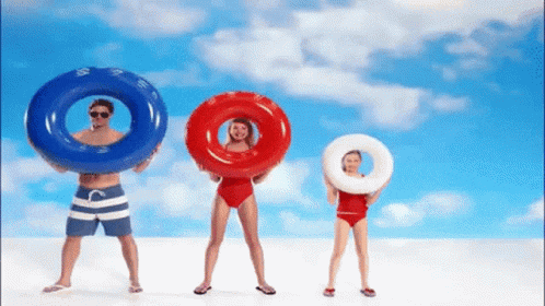 a man a woman and a little girl are holding floats over their heads