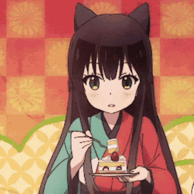a girl in a kimono is eating a piece of cake