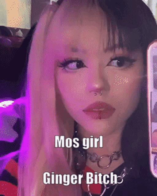 a mos girl ginger bitch is holding a phone