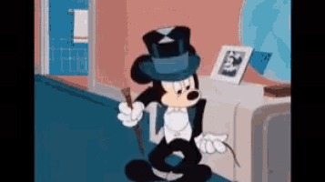 a cartoon of mickey mouse wearing a top hat and tuxedo