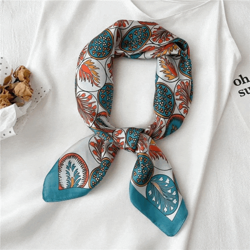 a white shirt with a scarf tied around it