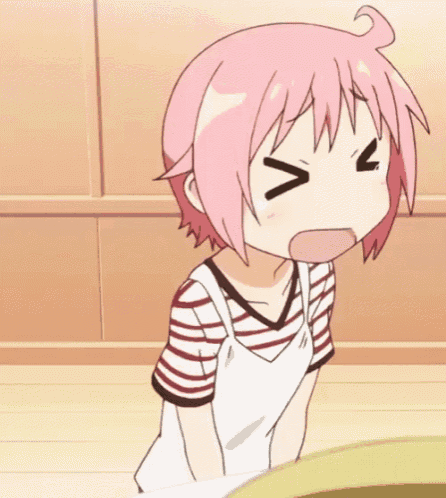 a girl with pink hair is making a face with her eyes closed