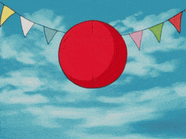 a red balloon hanging from a string of flags