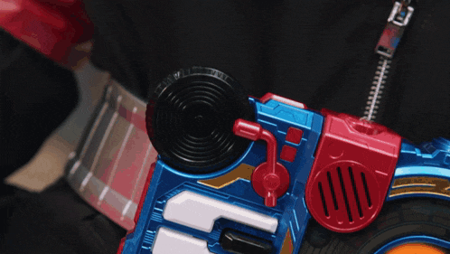 a person is playing with a toy that has the letter f on it