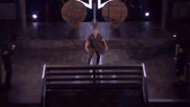 a stage with a large t on it and fireworks