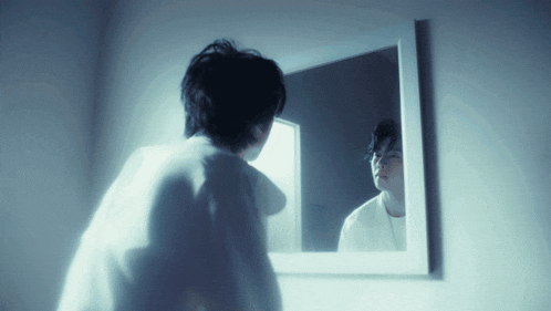 a person looking at themselves in a mirror