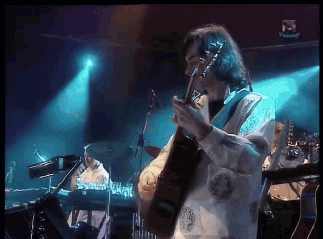 a man playing a guitar on a stage with a watermark that says ' videocraft '