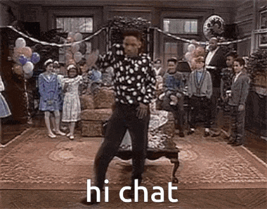 a man is dancing in a room with balloons and a group of children .