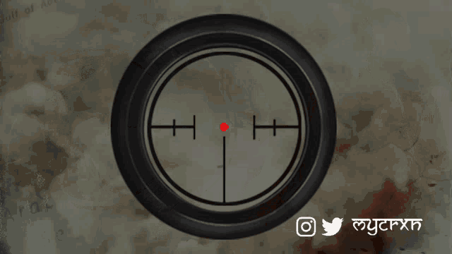 a man is standing in front of a scope with a red dot in the middle