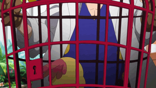 a man in a blue shirt is in a red cage with the letter s on the lock