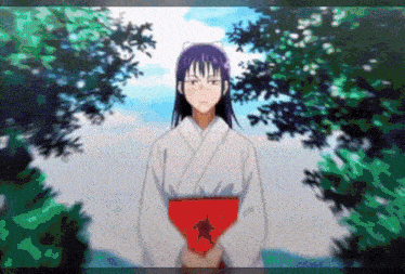 a woman in a kimono is holding a red item in her hands