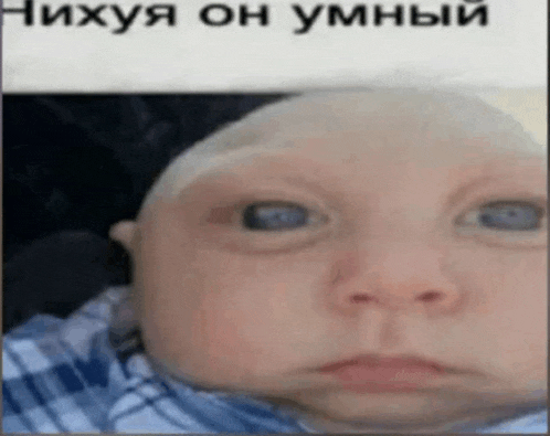 a baby with a bald head is making a funny face in a foreign language .