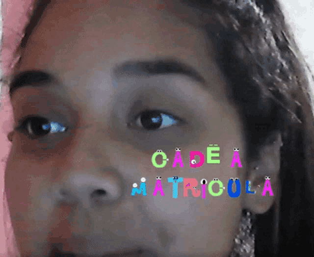 a close up of a woman 's face with the words cade a matricula written on her face