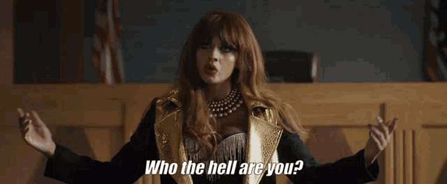 a woman says who the hell are you while standing in a courtroom