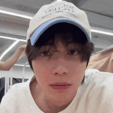 a close up of a person wearing a baseball cap that says ' i love you ' on it