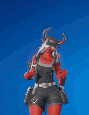 a red devil with horns is standing in front of a blue sky .