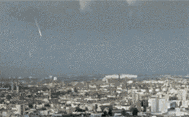 a black and white photo of a man 's face with smoke coming out of it