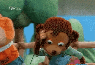 a stuffed animal with a tv peru logo in the corner
