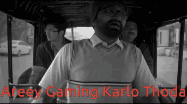 a black and white photo of a man with the words areey gaming karlo thoda on the bottom