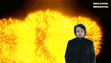 a man stands in front of a fireworks display with the name emile aleman visible