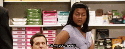 a woman is standing next to a man in a store and says `` oh my god , i love it . ''