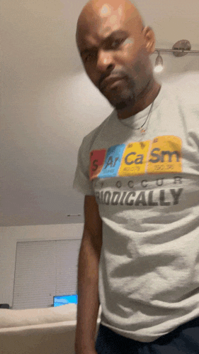 a man wearing a t-shirt that says sarcasm
