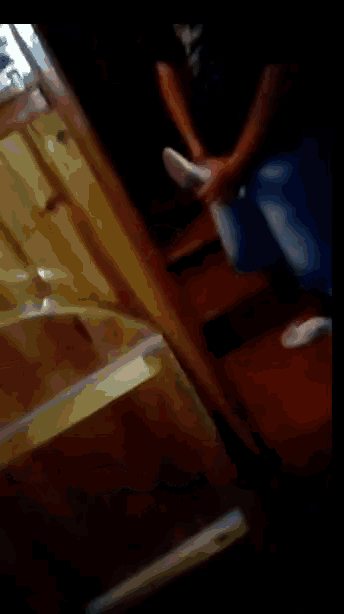 a blurry image of a person sitting on a staircase