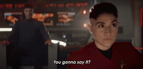 a woman in a red shirt is saying you gonna say it .