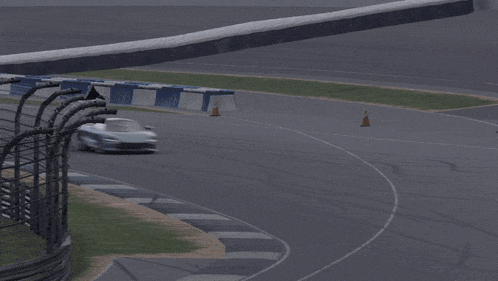 a race car is driving down a race track