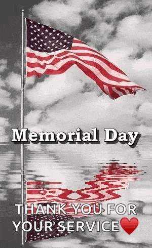 a black and white photo of an american flag waving in the wind with the words `` memorial day thank you for your service '' .