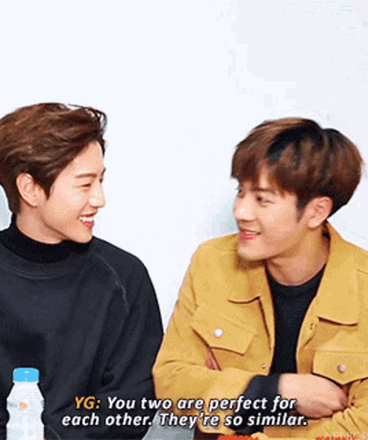 two young men are sitting next to each other and they are perfect for each other they are so similar
