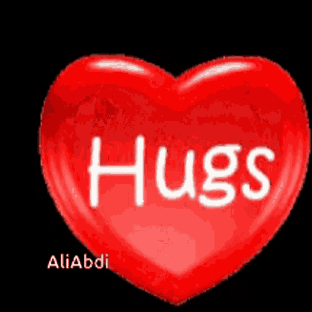 a red heart with hugs written on it