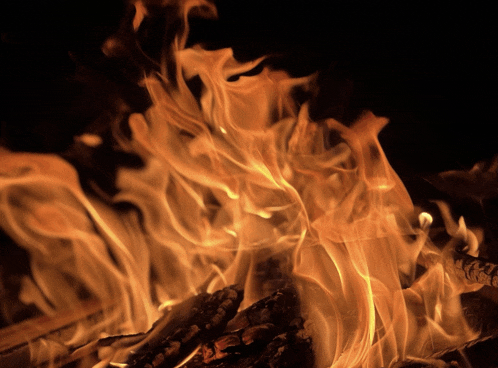 a close up of a fire with lots of flames