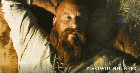 a man with a beard is laying down with his eyes closed and the words lastwitchhunter below him