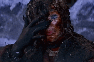 a close up of a person 's face covered in blood