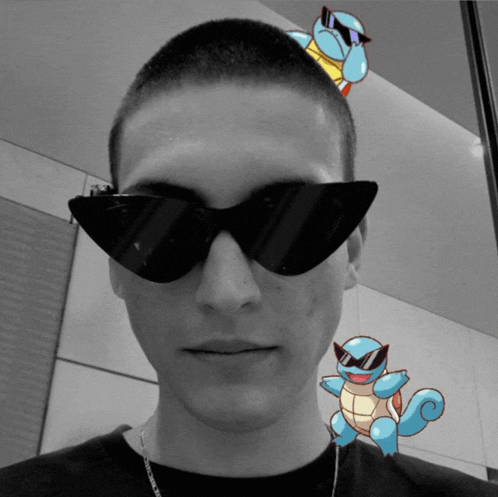 a man wearing sunglasses with squirtle on his head