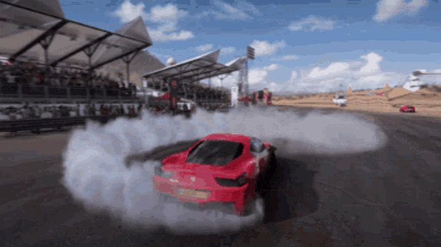 a red car with a license plate that says ' jcw ' on it is drifting on a track