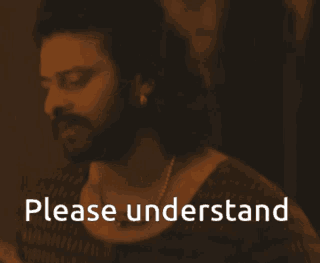 a man with a beard and a necklace has the words please understand below him