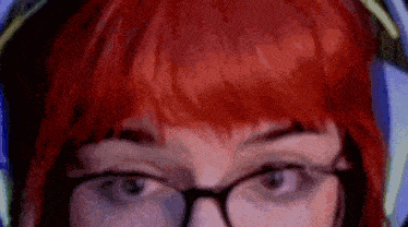 a close up of a person wearing glasses and headphones .