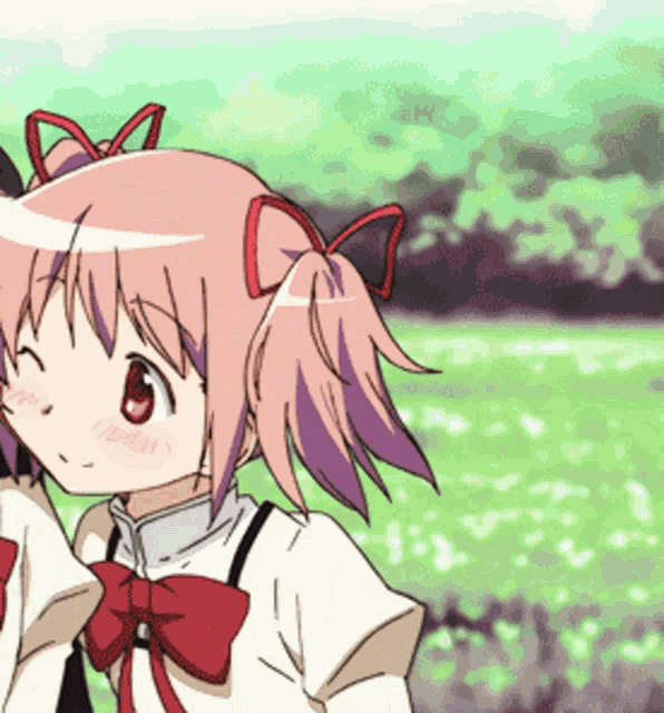 a girl with pink hair and a red bow on her head