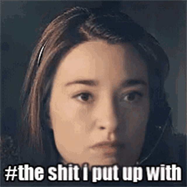 a close up of a woman 's face with the words the shit i put up with