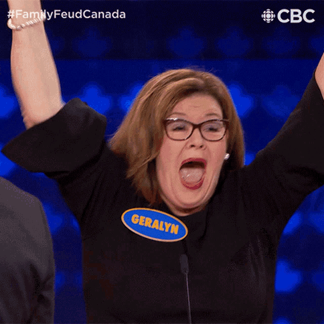a woman with her arms in the air and a name tag that says geraldyn