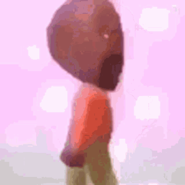 a cartoon character with a beard is standing in front of a pink background .
