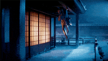 a person is hanging upside down from a building