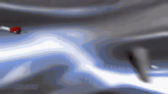 a blurred image of a person flying in the air with the word attack in the corner