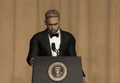 a man in a tuxedo stands behind a podium that says president of the united states