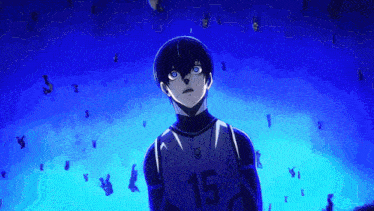 a boy with blue eyes and the number 15 on his shirt is standing in a dark room .